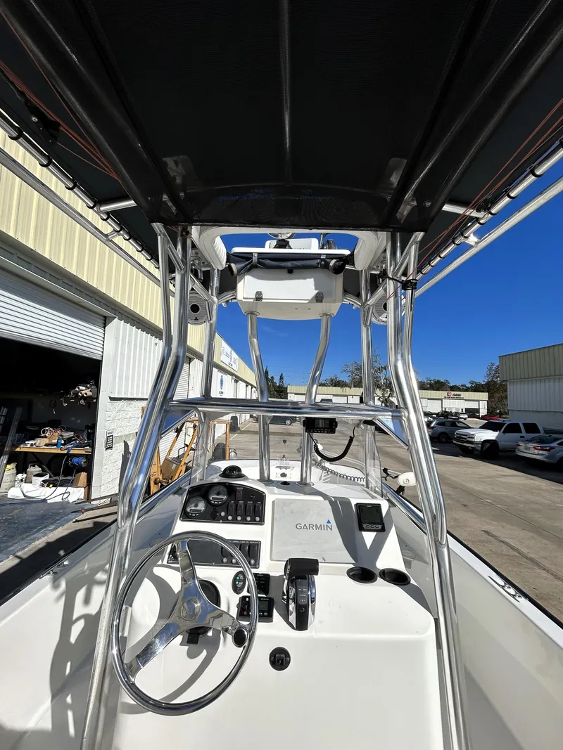 Slide: The Image of Boston Whaler 210 Montauk 2015 boat interior with steering wheel and control panel. - 9