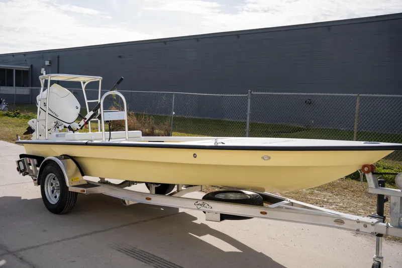 The Image of 2024 Cayo Boatworks 173 on a trailer outside a warehouse. - 0