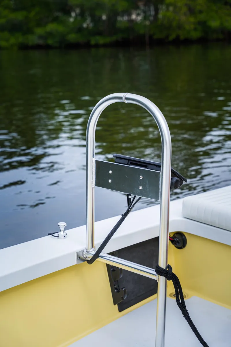 Slide: The Image of 2024 Cayo Boatworks 173, rear view of boat railing and calm water. - 12