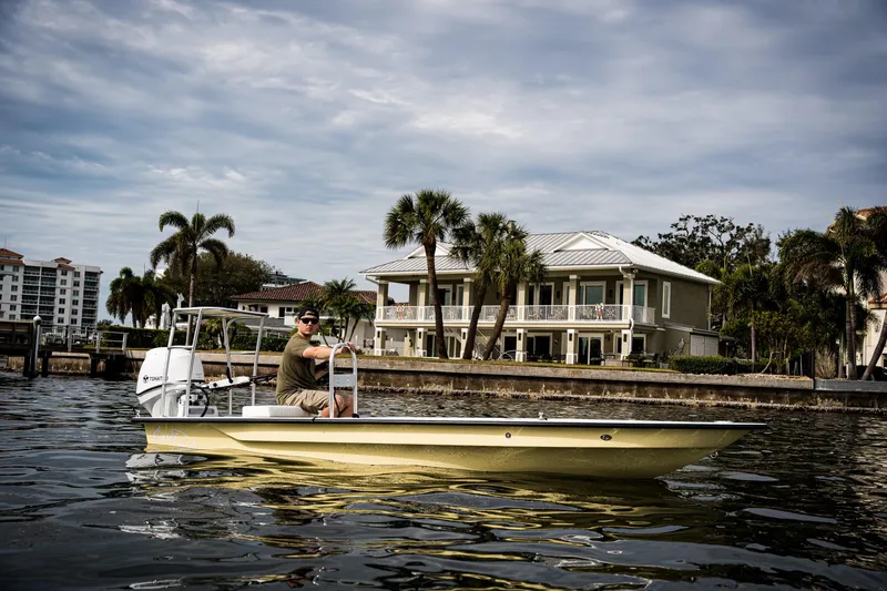 Slide: The Image of 2024 Cayo Boatworks 173 on water near waterfront homes. - 18