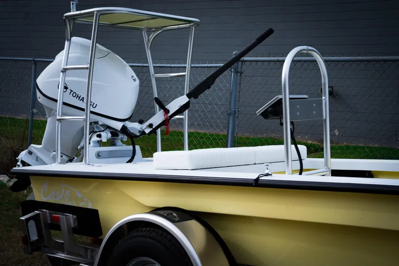 Slide: The Image of 2024 Cayo Boatworks 173 with Tohatsu outboard motor on trailer. - 2