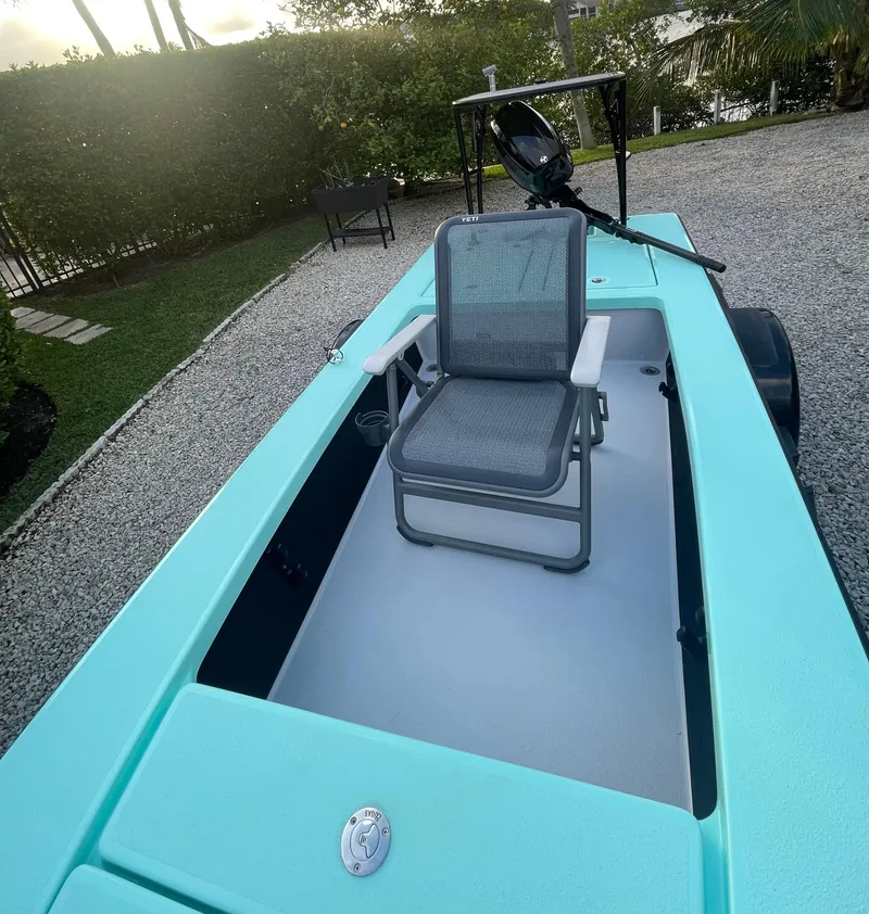 Slide: The Image of 2024 Cayo Boatworks 173 in turquoise, featuring a comfortable seating area. - 23