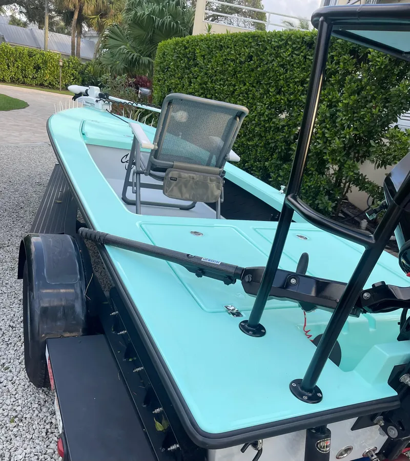 Slide: The Image of 2024 Cayo Boatworks 173 on trailer, mint green deck, ready for fishing. - 35
