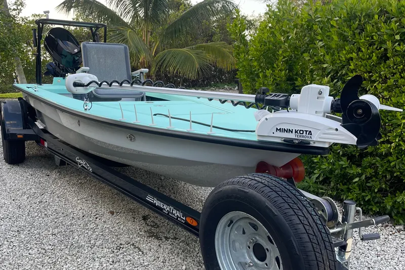Slide: The Image of 2024 Cayo Boatworks 173 on trailer with Minn Kota trolling motor. - 36
