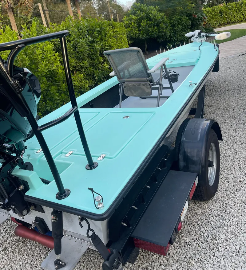Slide: The Image of 2024 Cayo Boatworks 173 on trailer, turquoise color, outdoor setting. - 37