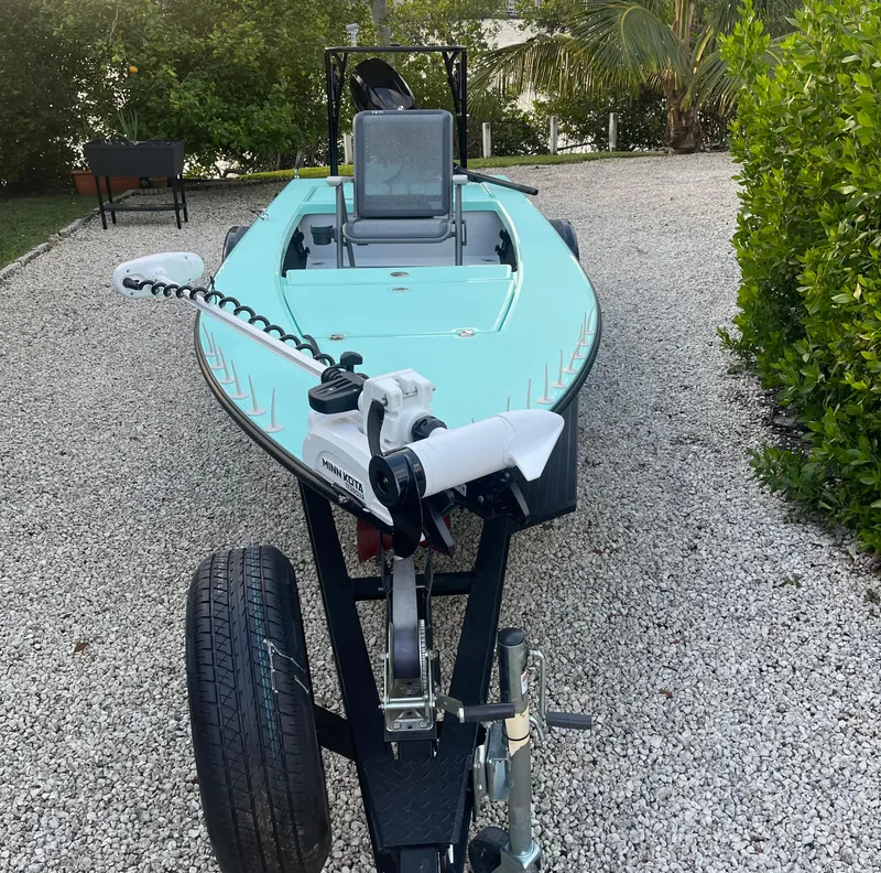 Slide: The Image of 2024 Cayo Boatworks 173 on a trailer in a gravel driveway. - 40