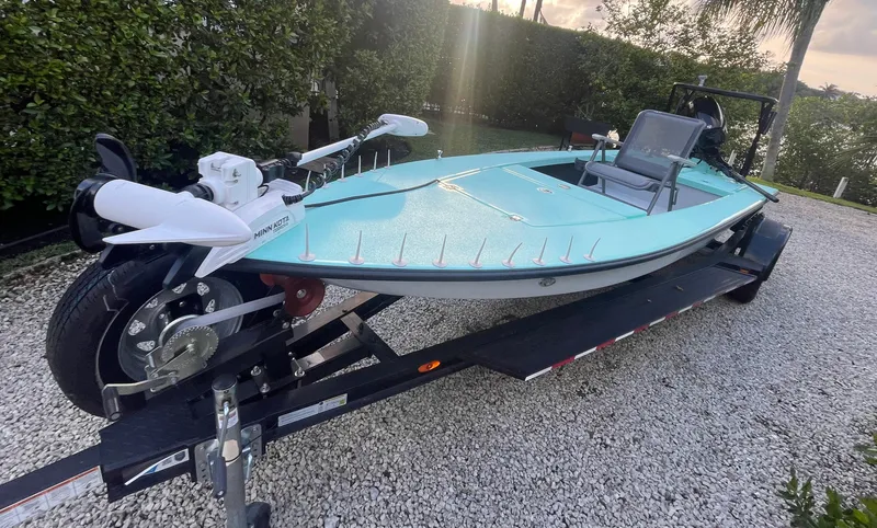 Slide: The Image of 2024 Cayo Boatworks 173 on trailer, turquoise hull, outdoor setting. - 41