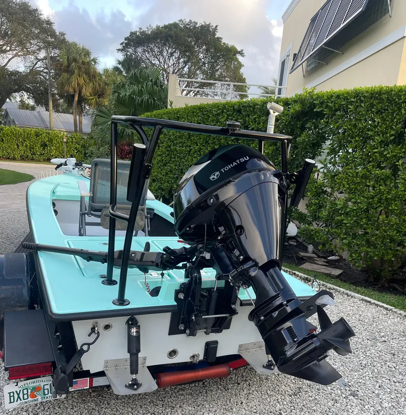 Slide: The Image of 2024 Cayo Boatworks 173 with Tohatsu outboard motor in driveway. - 42