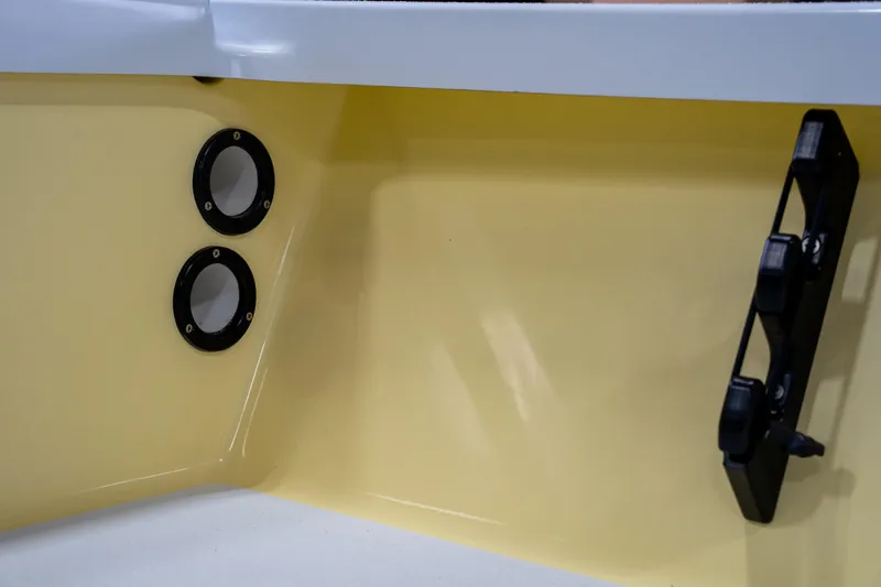 Slide: The Image of 2024 Cayo Boatworks 173 interior detail with yellow finish and black fittings. - 6