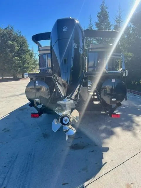 Slide: The Image of 2024 Regency 250 LE3 boat with powerful outboard motor. - 7