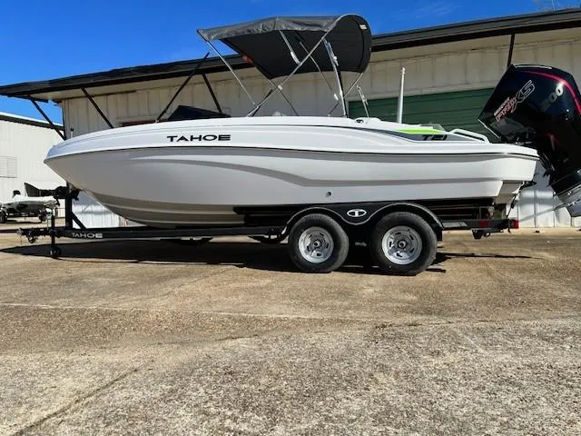 Slide: The Image of 2024 Tahoe T21 boat on a trailer with a canopy. - 0