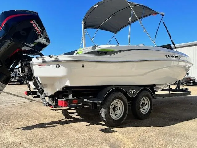 Slide: The Image of 2024 Tahoe T21 boat on trailer with outboard motor and canopy. - 1
