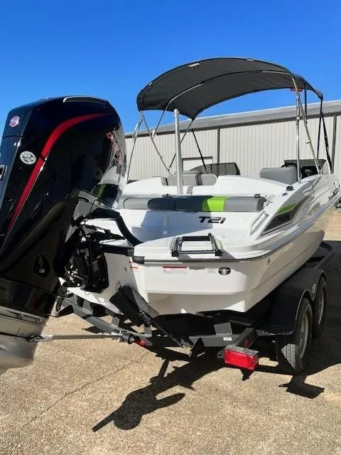 Slide: The Image of 2024 Tahoe T21 boat with outboard motor and trailer. - 2