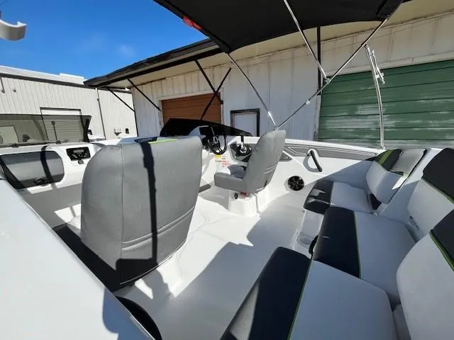 Slide: The Image of 2024 Tahoe T21 boat interior with seating and canopy. - 5