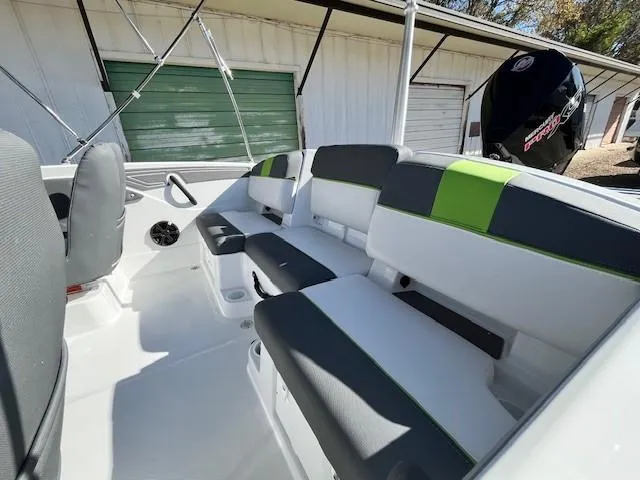 Slide: The Image of 2024 Tahoe T21 boat interior with modern seating and storage compartments. - 6