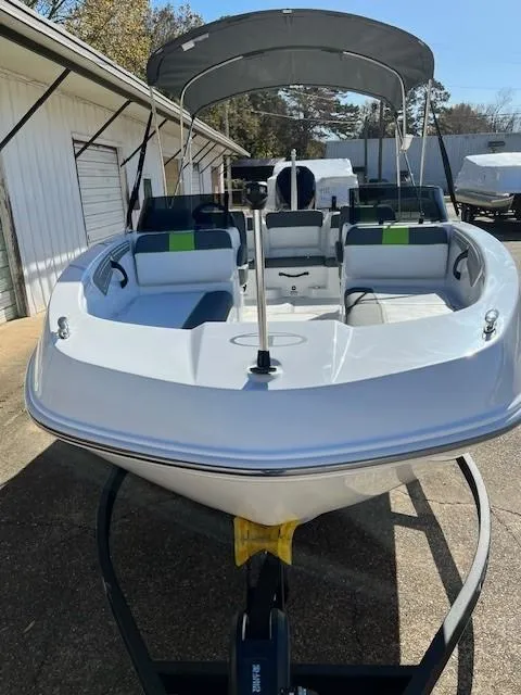 Slide: The Image of 2024 Tahoe T21 boat with canopy on trailer, front view. - 7