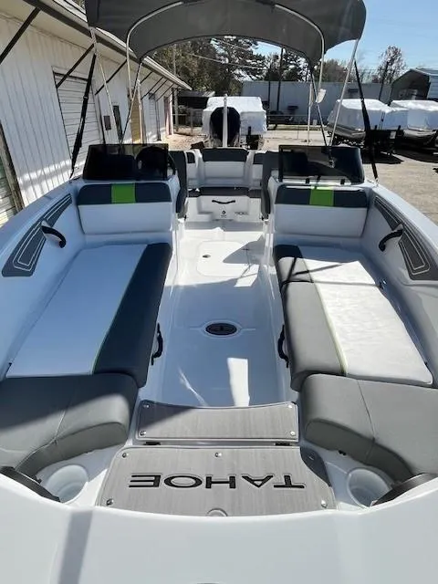 Slide: The Image of 2024 Tahoe T21 boat with spacious seating and canopy. - 8
