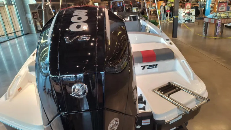 Slide: The Image of 2024 Tahoe T21 boat with 200 V6 engine on display in showroom. - 3
