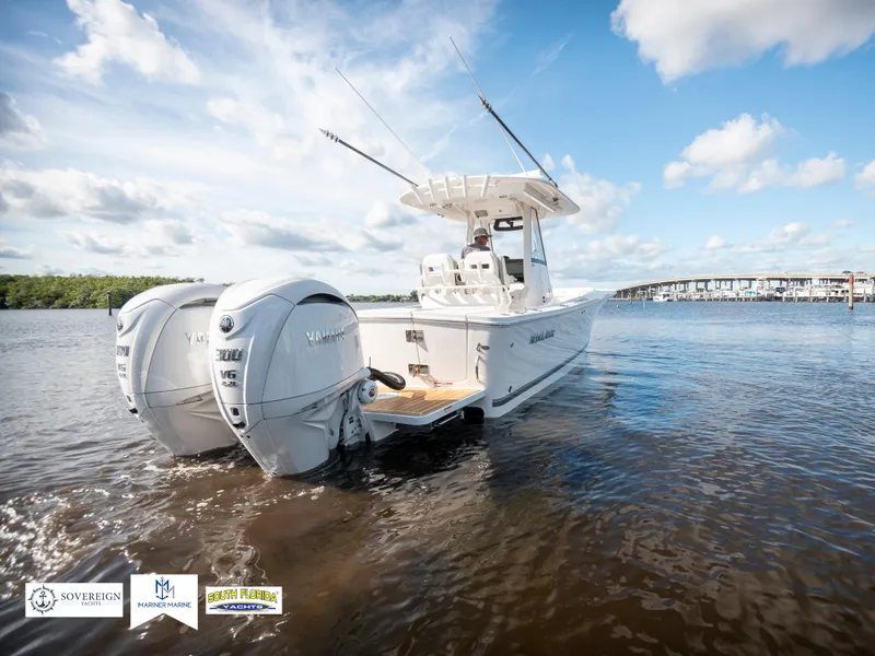 Slide: The Image of 2024 Regulator 28 boat with twin engines on a sunny day. - 10