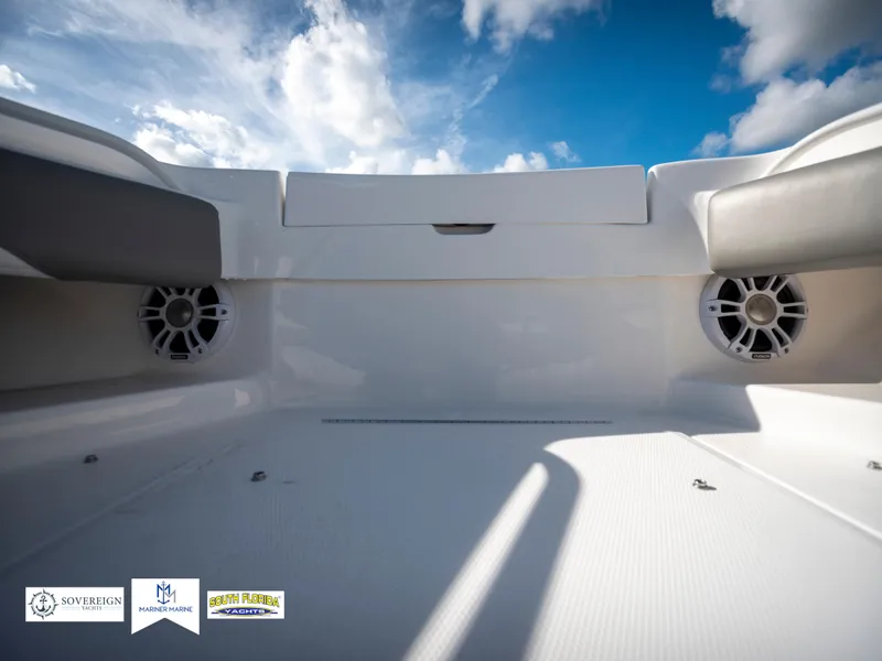 Slide: The Image of 2024 Regulator 28 boat interior with speakers under a blue sky. - 20