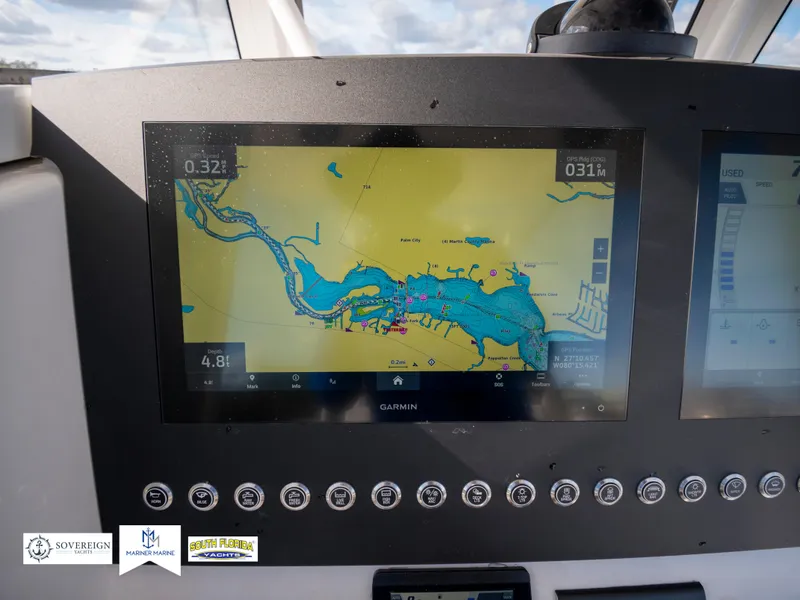Slide: The Image of Garmin navigation display on 2024 Regulator 28 boat dashboard. - 30