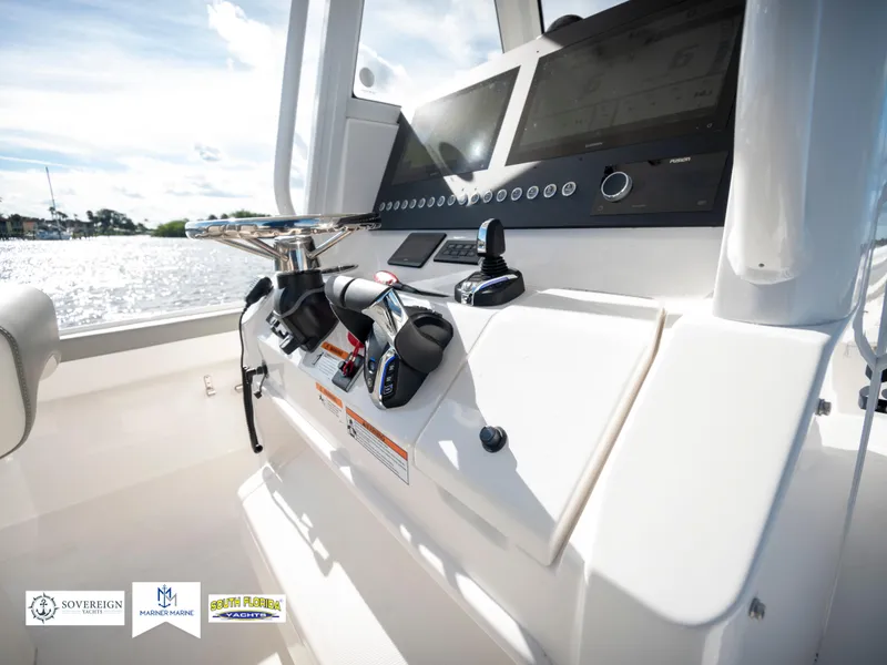 Slide: The Image of 2024 Regulator 28 boat console with advanced controls and dual screens. - 32
