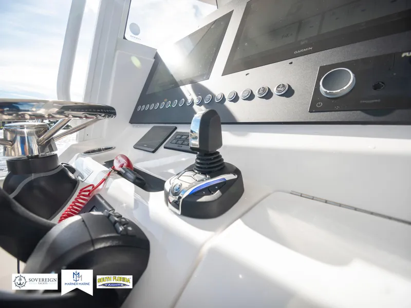 Slide: The Image of 2024 Regulator 28 boat dashboard with modern controls and navigation system. - 34