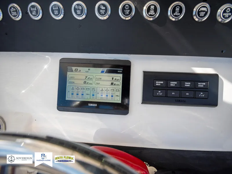 Slide: The Image of 2024 Regulator 28 boat dashboard with Yamaha display and control panel. - 35
