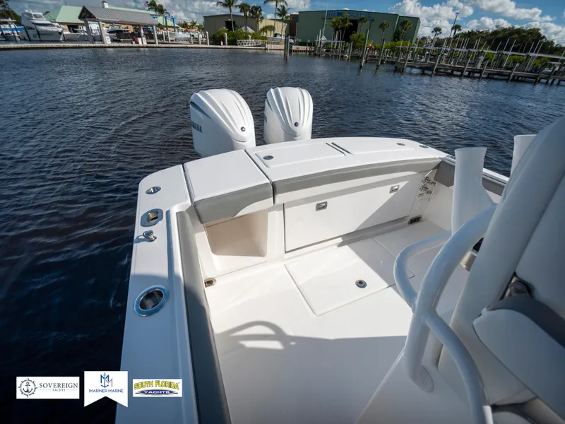 Slide: The Image of 2024 Regulator 28 boat with dual engines docked in a marina. - 37