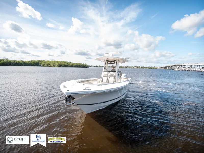 Slide: The Image of 2024 Regulator 28 boat cruising on a sunny day in open water. - 4