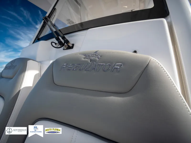 Slide: The Image of 2024 Regulator 28 boat seat with logo, featuring sleek design and premium upholstery. - 48
