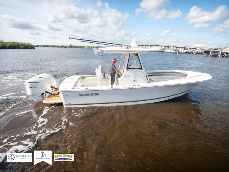 Slide: The Image of 2024 Regulator 28 boat cruising on a sunny day with clear skies. - 8