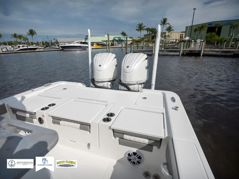 Slide: The Image of 2024 Regulator 30XO boat with dual engines docked at marina. - 13