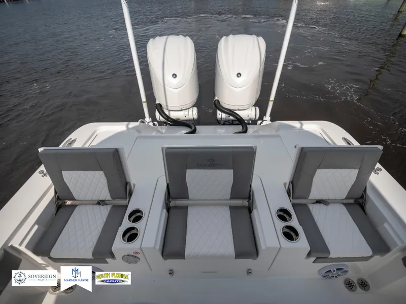 Slide: The Image of 2024 Regulator 30XO boat with triple seating and twin engines on water. - 16