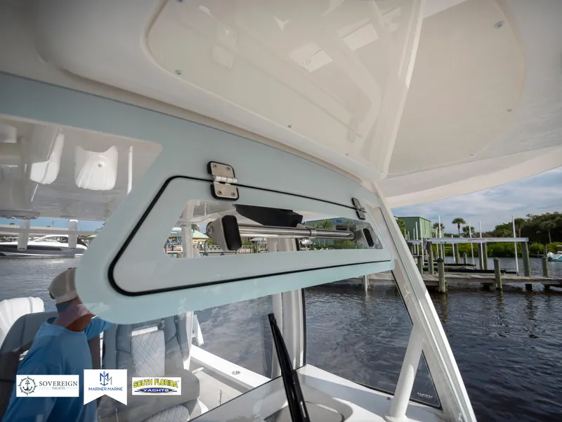 Slide: The Image of 2024 Regulator 30XO boat interior with open window, dockside view. - 18