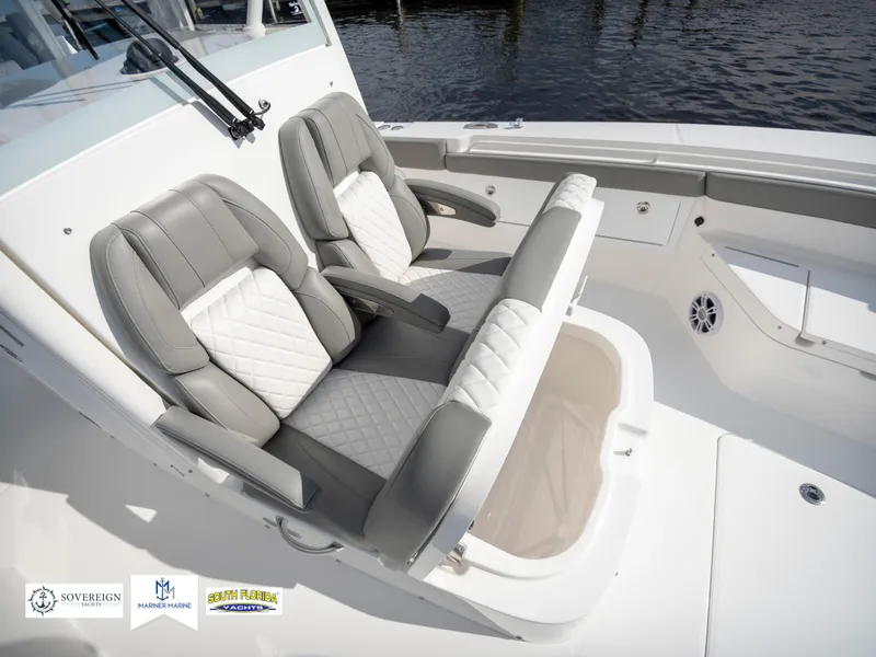 Slide: The Image of 2024 Regulator 30XO boat with luxurious seating and storage compartment. - 19