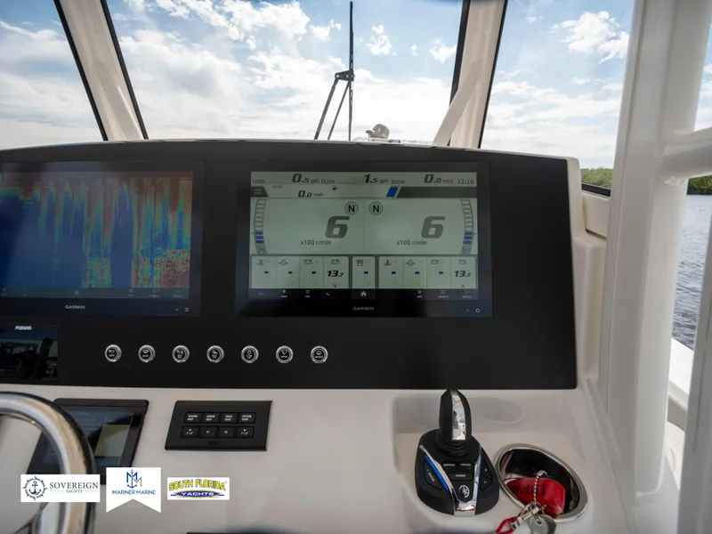 Slide: The Image of 2024 Regulator 30XO boat dashboard with advanced navigation displays. - 23