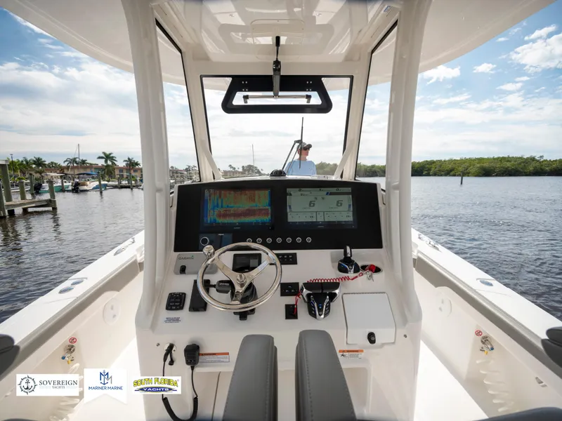 Slide: The Image of 2024 Regulator 30XO boat cockpit with advanced navigation system and dual seating. - 27