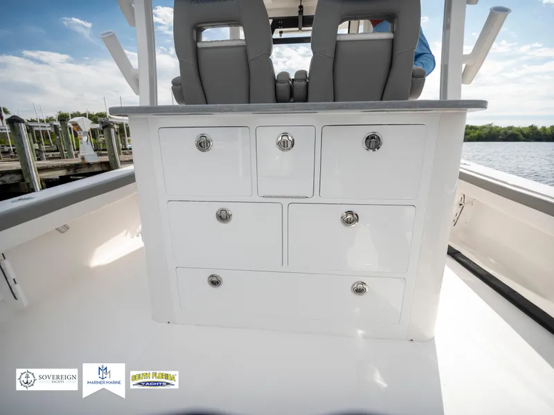 Slide: The Image of 2024 Regulator 30XO boat interior with storage drawers and seating. - 31