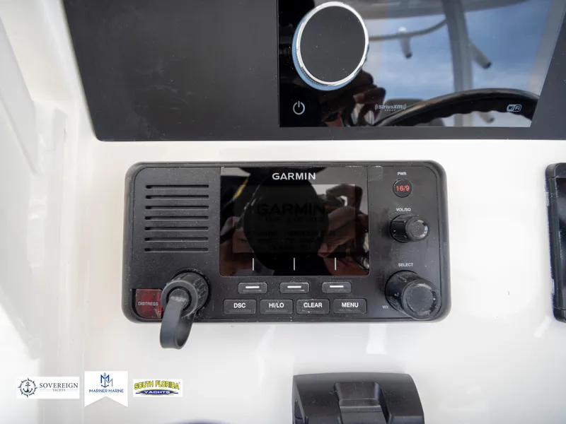 Slide: The Image of Garmin marine radio on 2024 Regulator 30XO boat dashboard. - 32