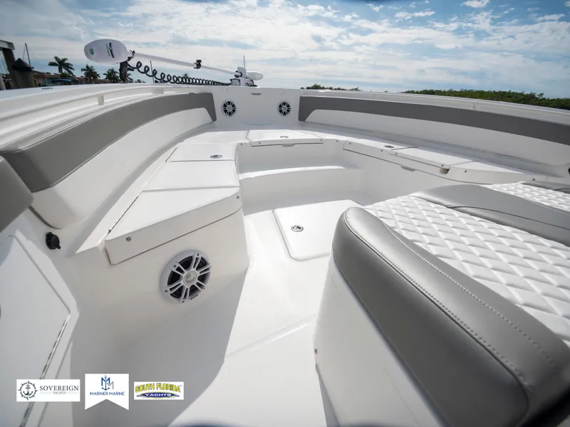 Slide: The Image of 2024 Regulator 30XO boat interior with cushioned seating and speakers. - 35