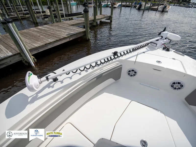 Slide: The Image of 2024 Regulator 30XO boat bow with trolling motor at dock. - 36