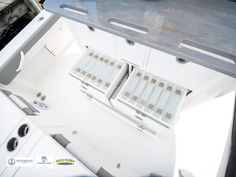 Slide: The Image of 2024 Regulator 30XO boat interior with storage compartments and seating. - 39