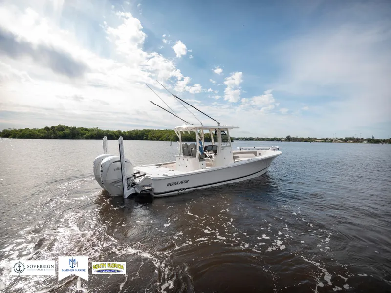 Slide: The Image of 2024 Regulator 30XO boat cruising on a sunny day in open water. - 5