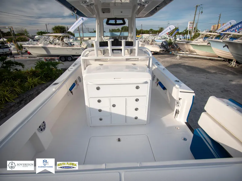 Slide: The Image of 2024 Regulator 31 boat interior with storage compartments and seating. - 12