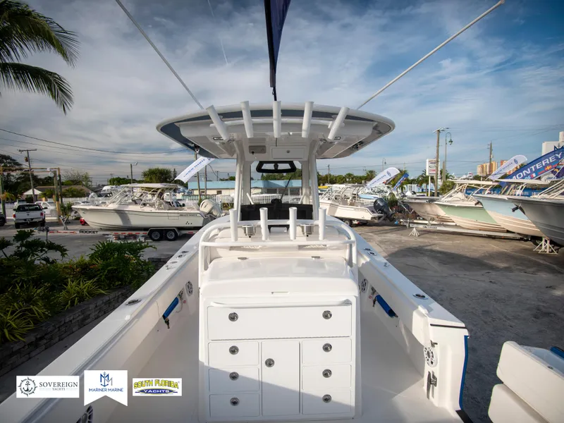 Slide: The Image of 2024 Regulator 31 boat interior at a dealership. - 13