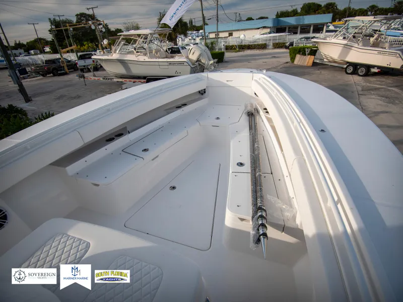 Slide: The Image of 2024 Regulator 31 boat interior, spacious deck with storage compartments. - 14
