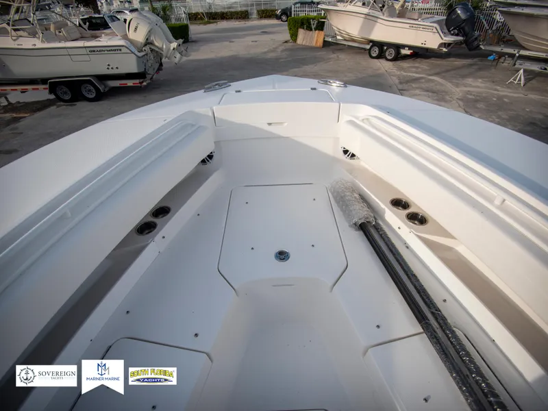 Slide: The Image of 2024 Regulator 31 boat interior, bow seating area with storage compartments. - 15