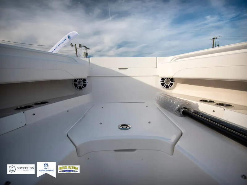Slide: The Image of 2024 Regulator 31 boat interior with storage compartments and speakers. - 16