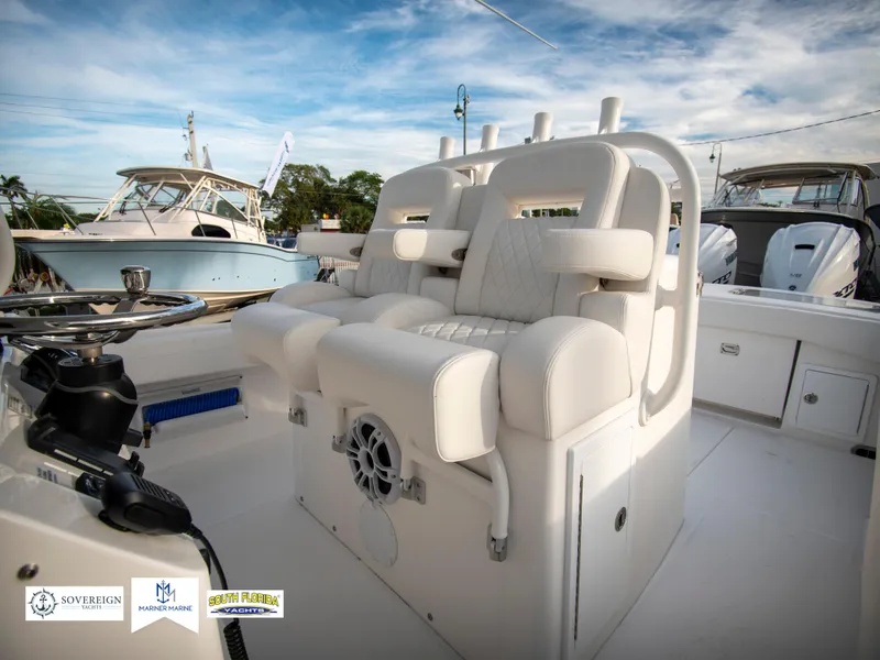 Slide: The Image of 2024 Regulator 31 boat interior with white cushioned seating. - 22